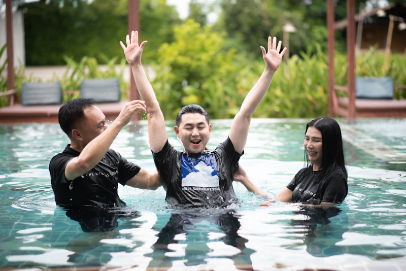 A group gathered around a baptism pool