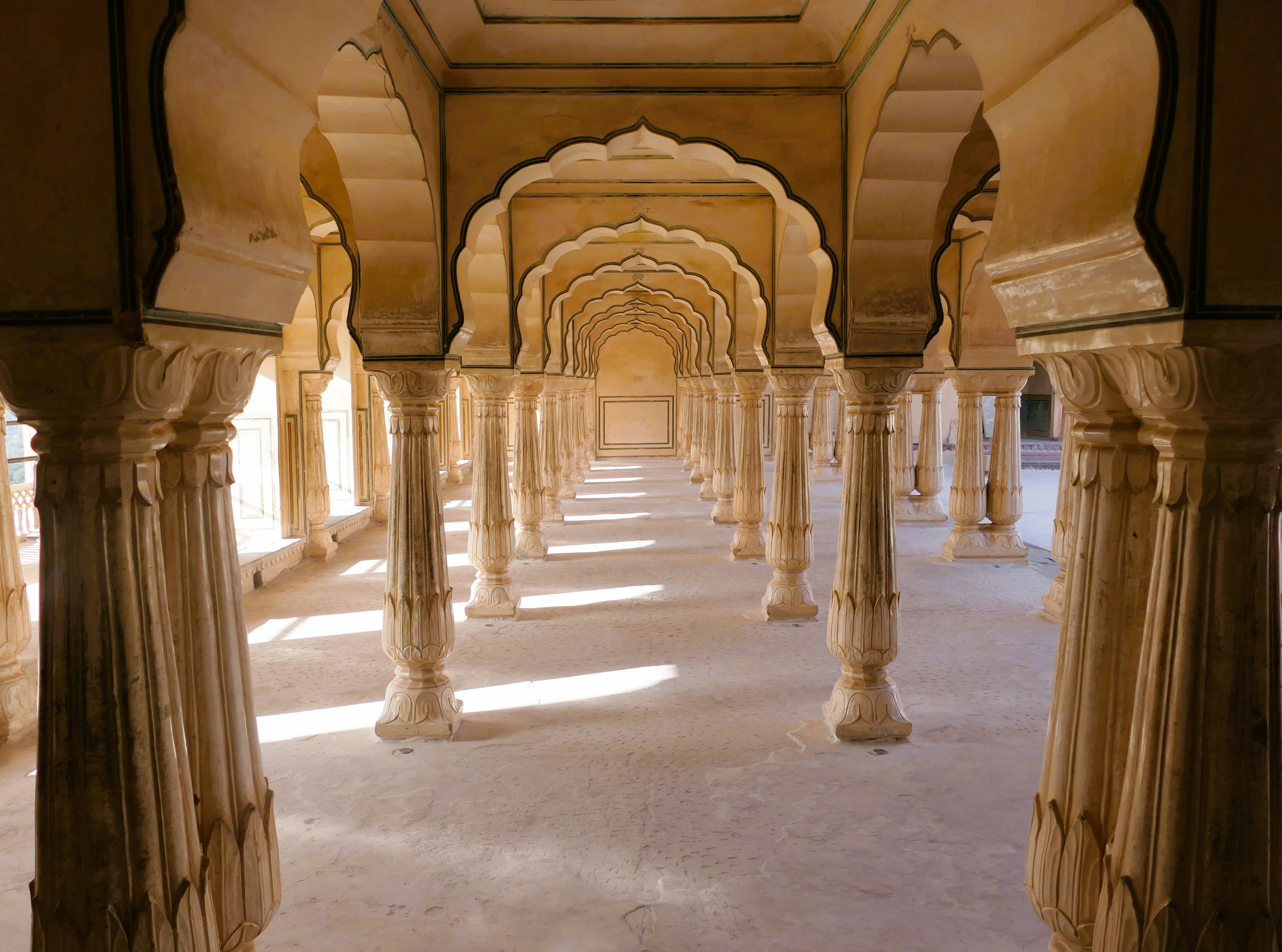 a hallway with pillars