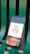 A smartphone displaying an app interface with a design that reads 'Time is Money' alongside a money bag icon. The phone is placed on a green, metal bench with visible slats.