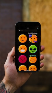 a hand holding a smart phone
