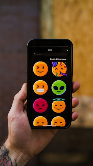 a hand holding a smart phone