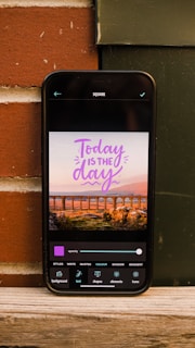 Photo of a mobile phone receiving a quote message via WhatsApp from the quote generator.