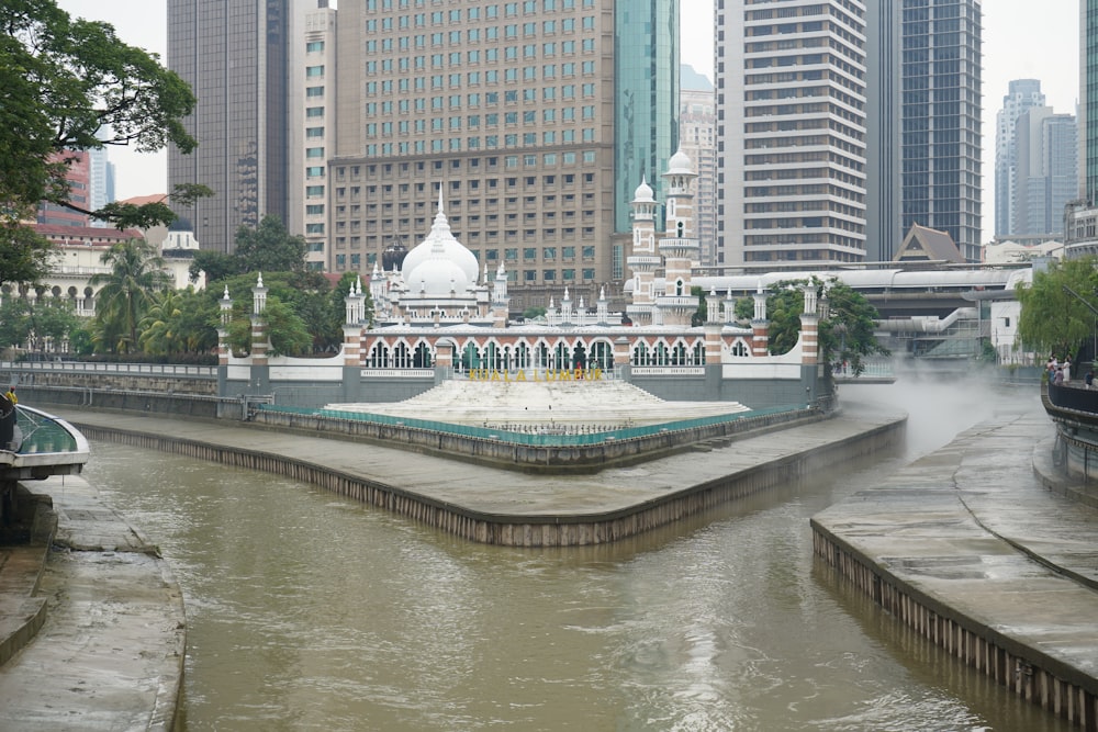 a body of water with a building in the middle of it