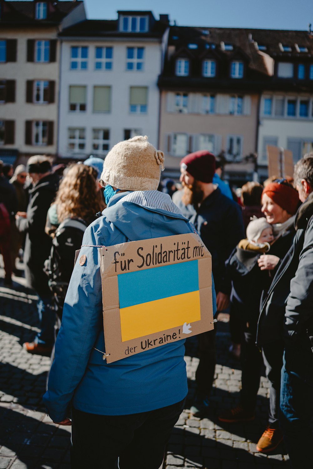 a group of people holding signs