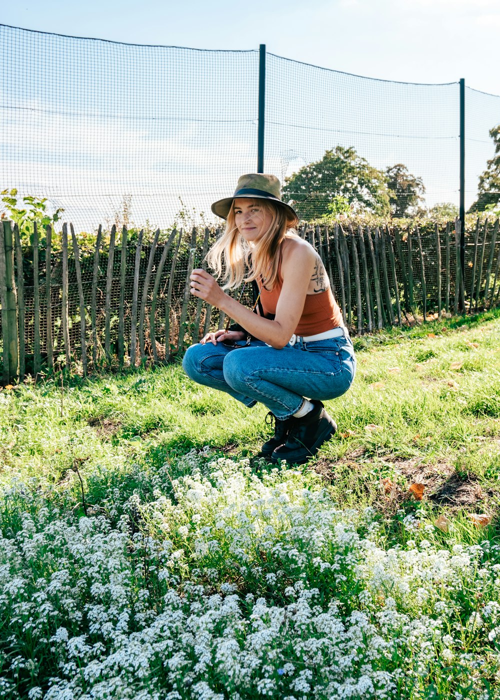 a person kneeling in a field