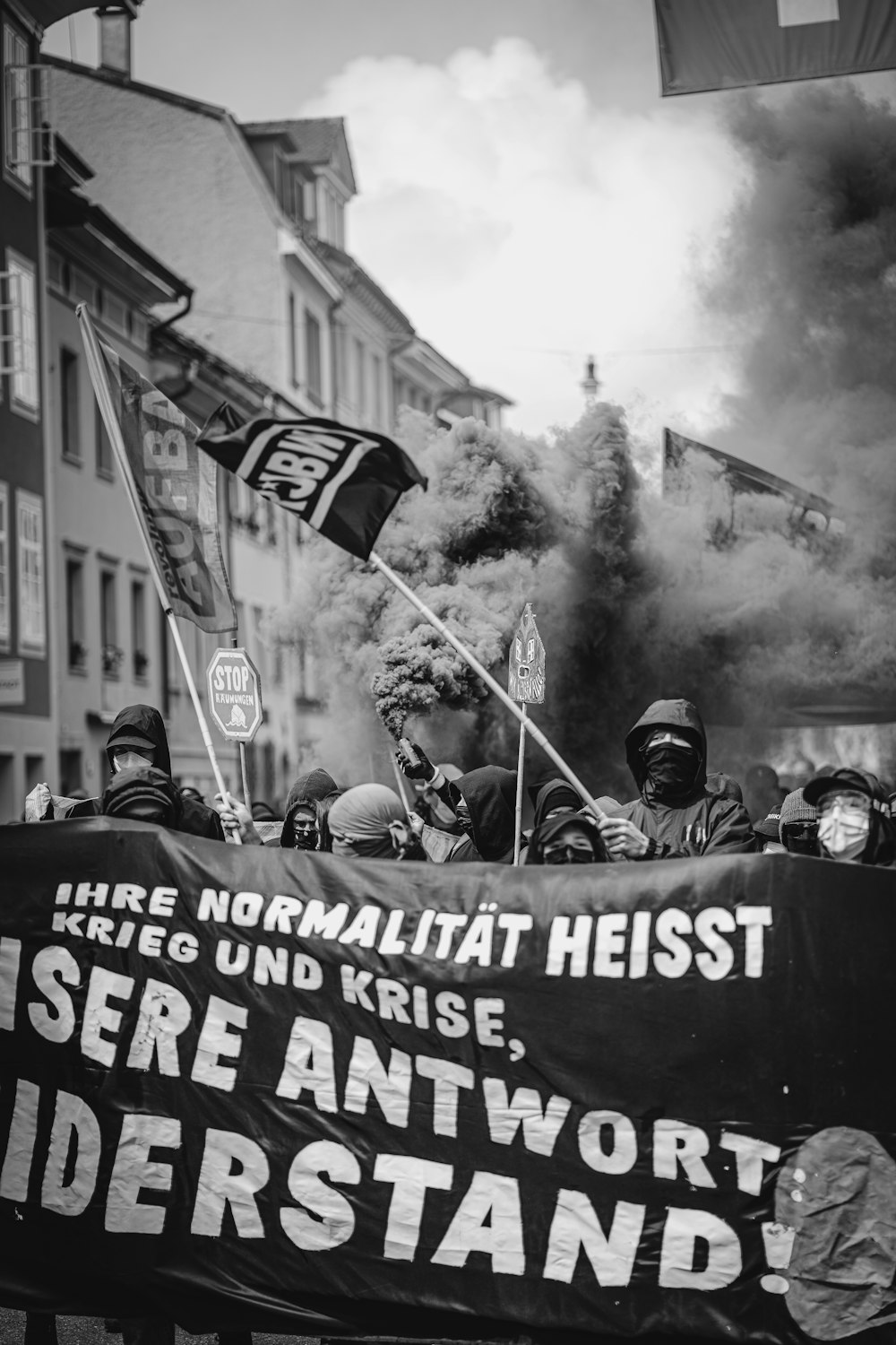 a group of people holding a sign