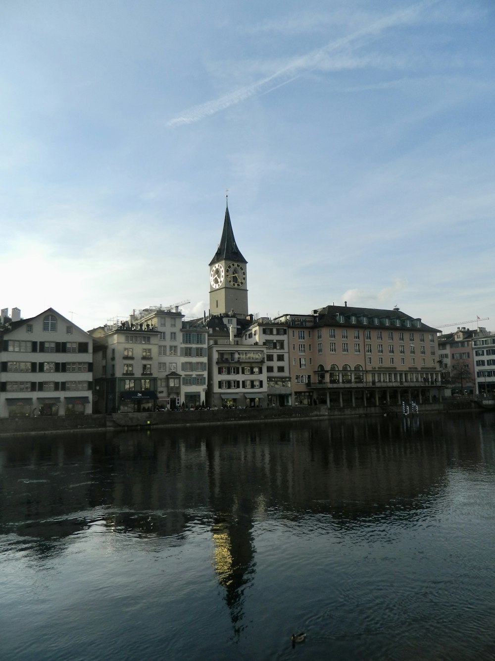 a body of water with buildings along it