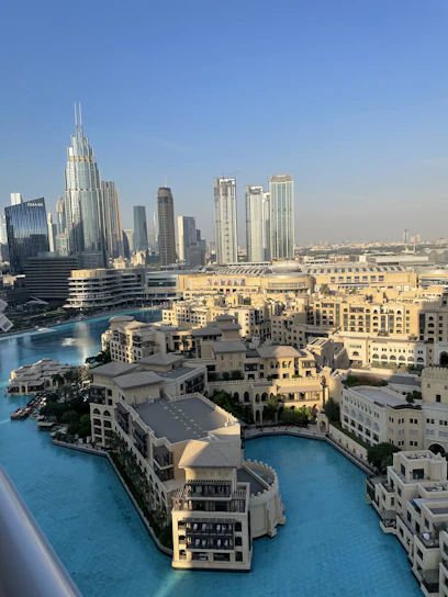 Modern Muscat skyline with luxurious residential buildings under a clear blue sky.