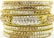 A stack of ornate bangles encrusted with sparkling gems. The bangles are layered with rows of white and brown stones, set against a rich gold background. The detailed craftsmanship and intricate patterns highlight their luxurious appearance.
