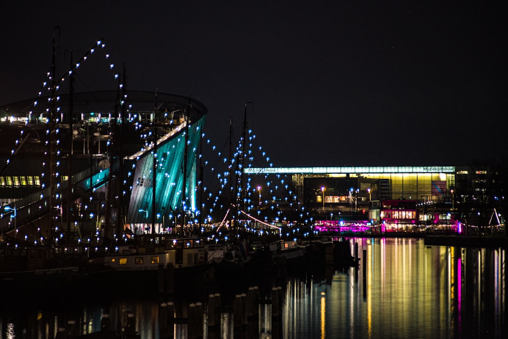 a bridge with lights and buildings at night