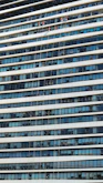 Professional staff in uniforms providing cleaning services in a bright office.