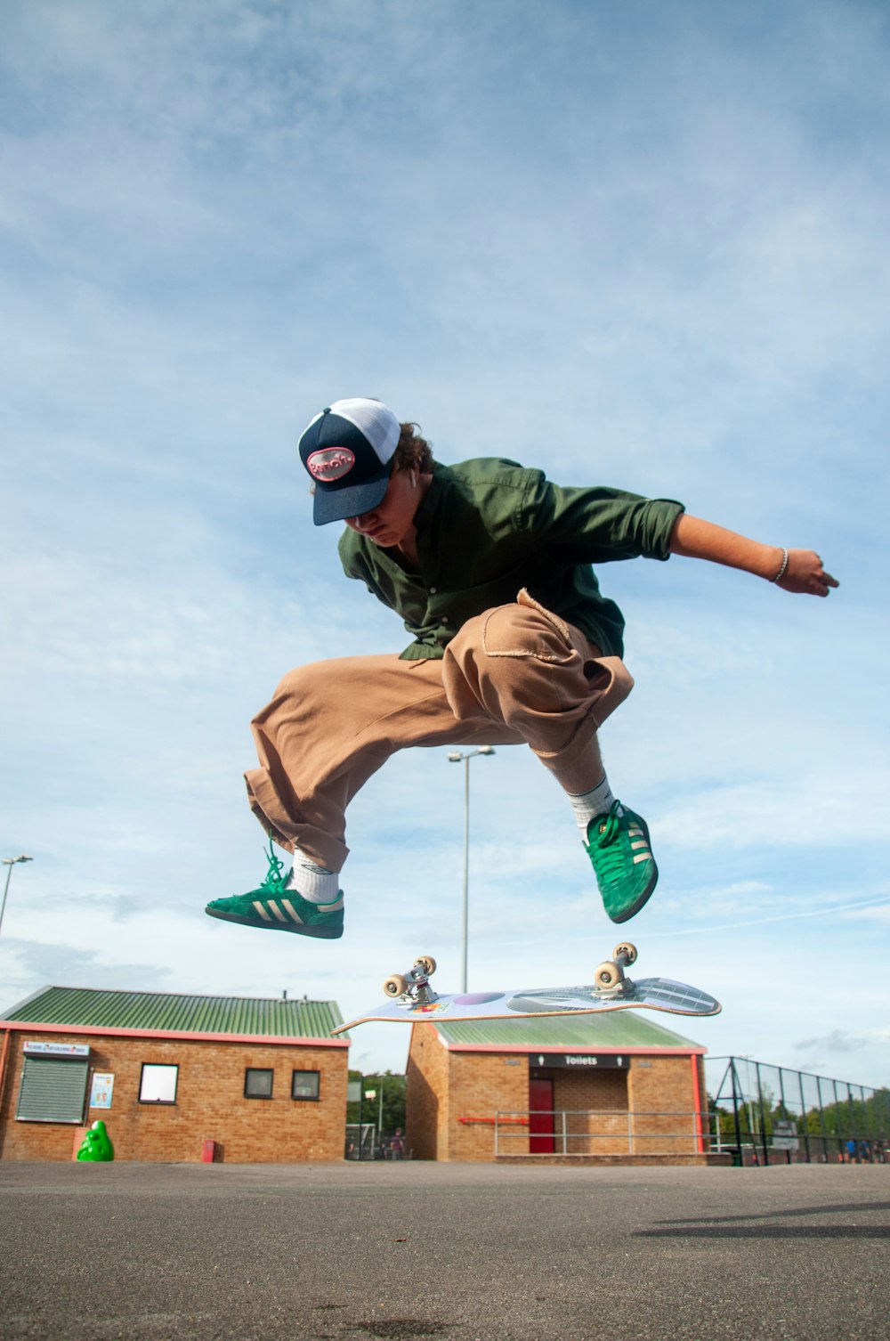 a man jumping in the air on a skateboard