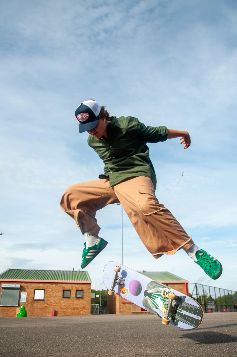 a man jumping in the air with a skateboard