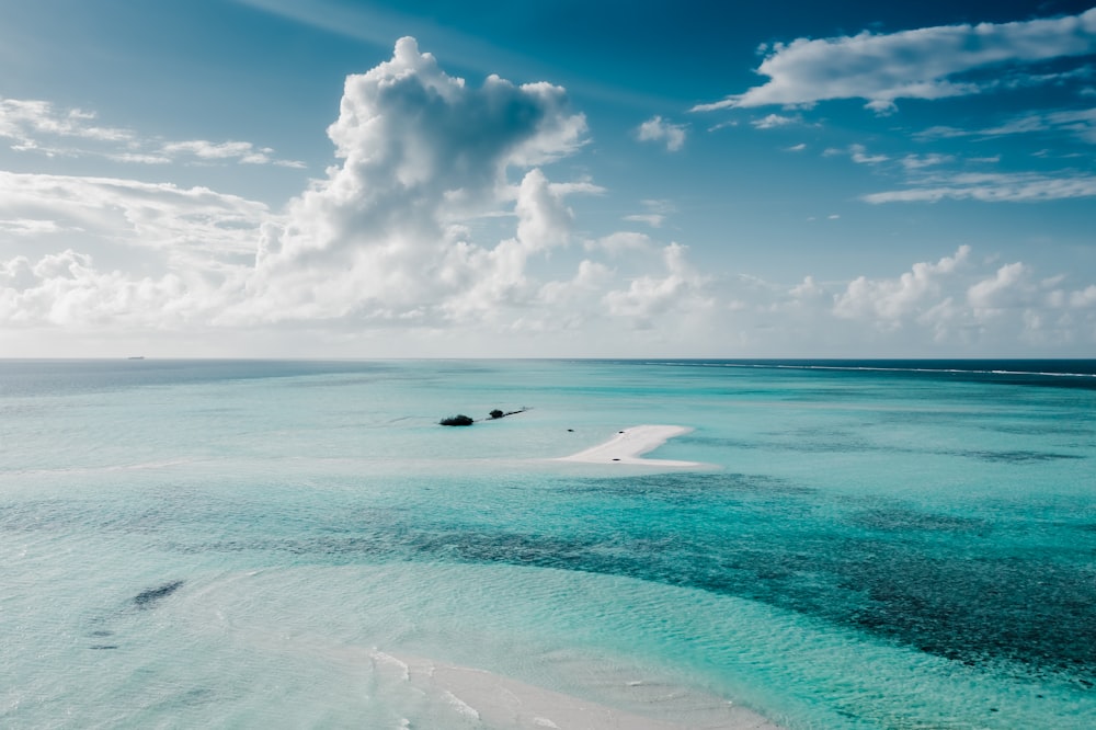 a plane flying over a beach