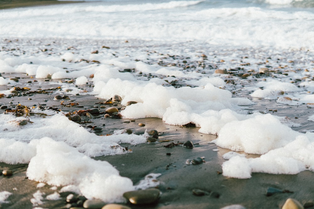 a body of water with ice and snow on it