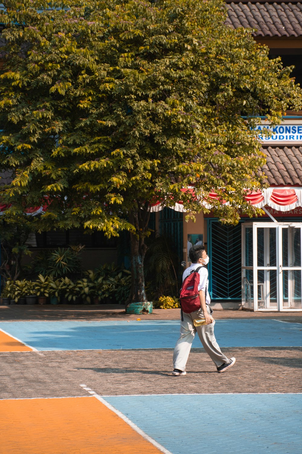 a person walking on a court