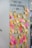 A wall is covered with numerous sticky notes in various colors such as pink, yellow, and orange. Above the notes, there is a message encouraging people to share their experiences. The sticky notes are filled with handwritten messages, some legible with phrases and doodles.