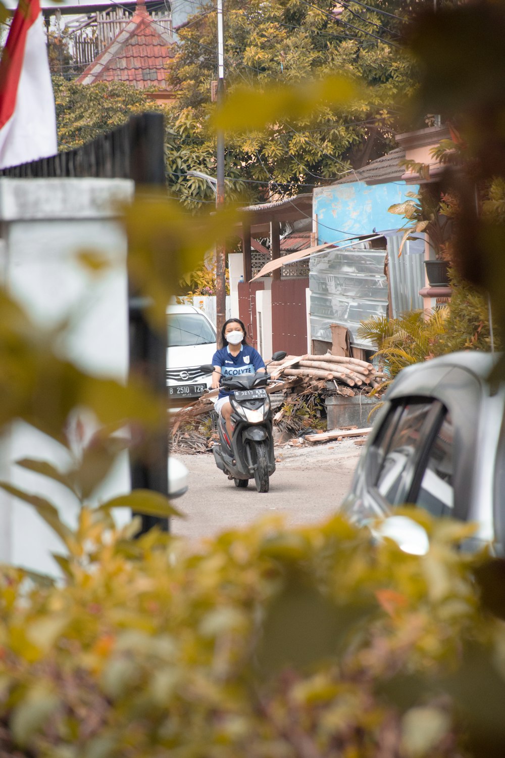 a person riding a motorcycle down a street