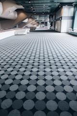 a large room with a large group of grey balls in it