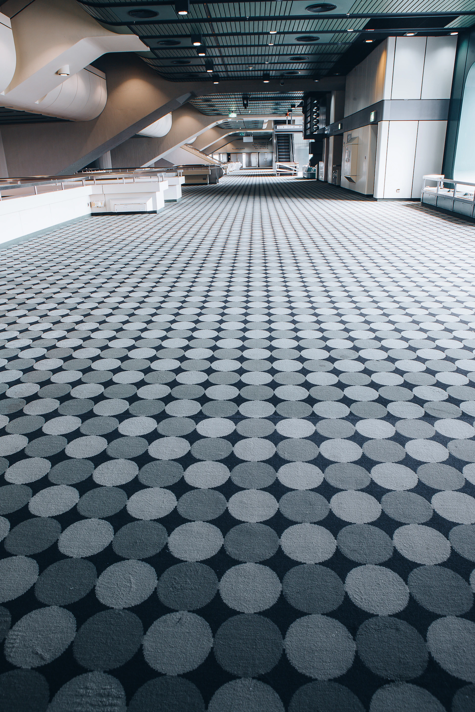 a large room with a large group of grey balls in it