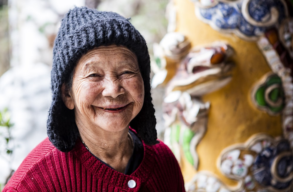 a person smiling with a hat