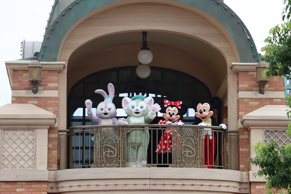 a group of stuffed animals on a balcony