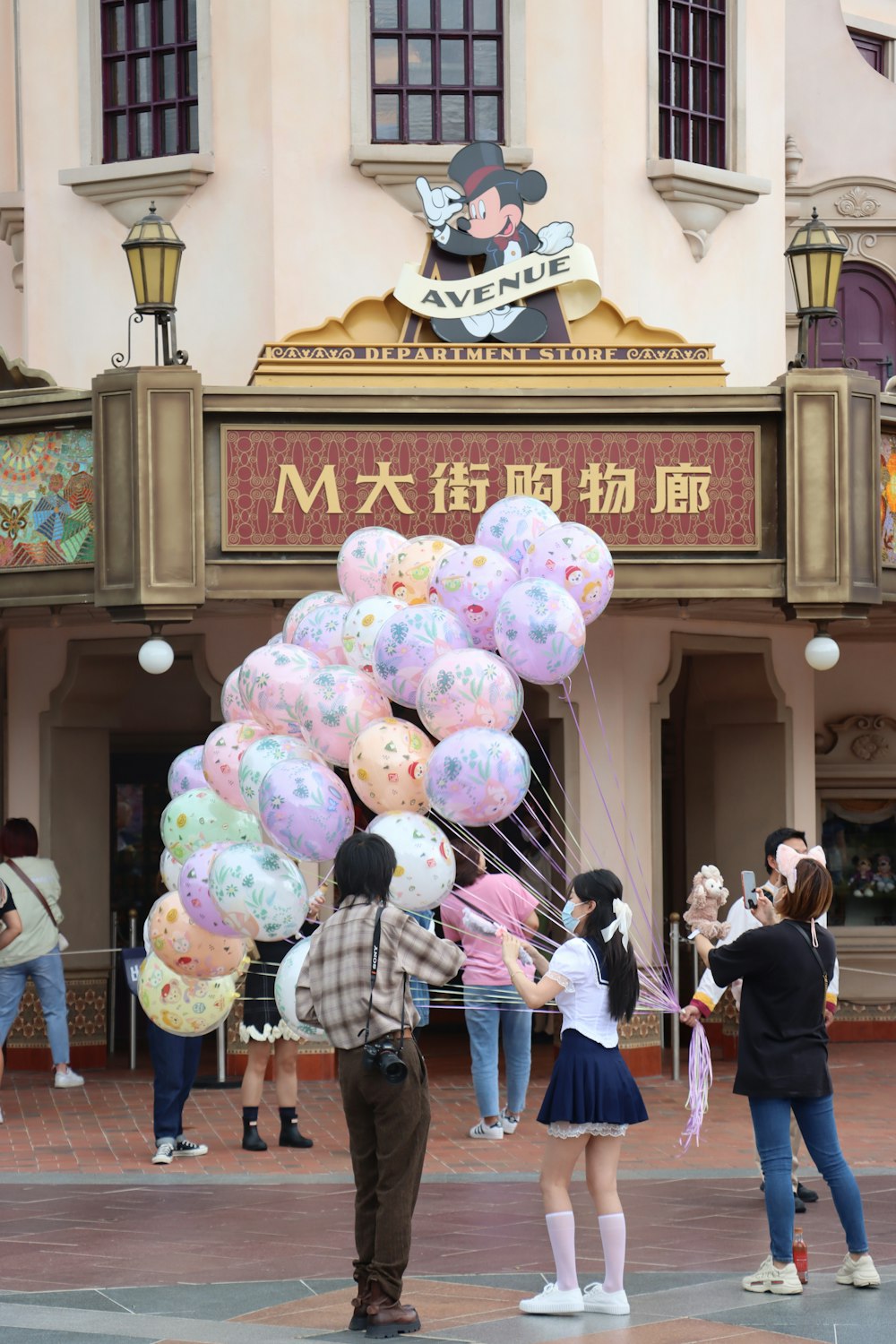 a group of people holding balloons