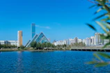 a body of water with a city in the background