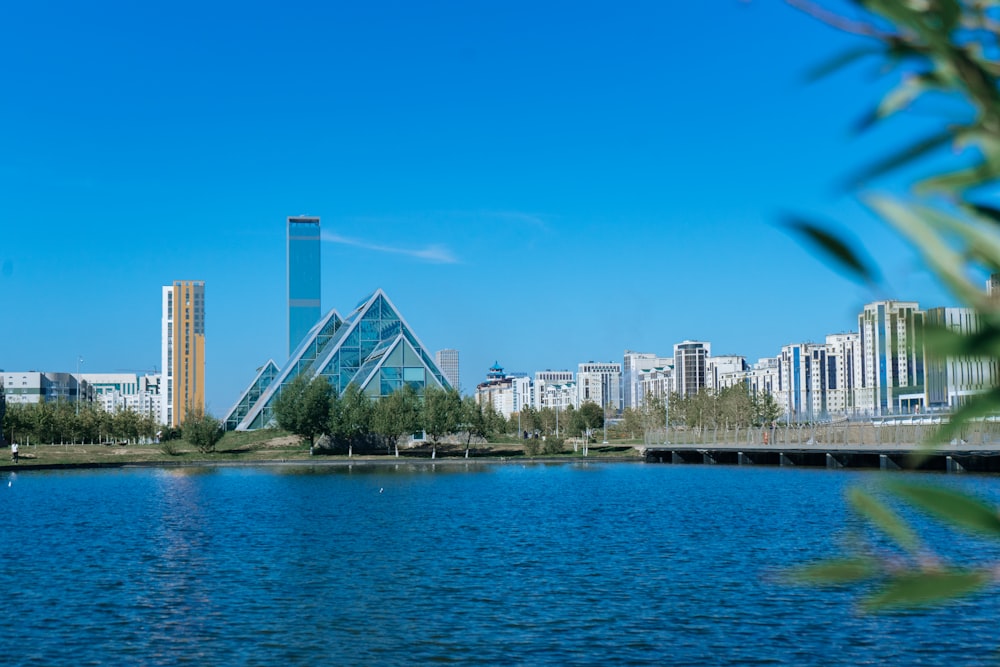 a body of water with a city in the background