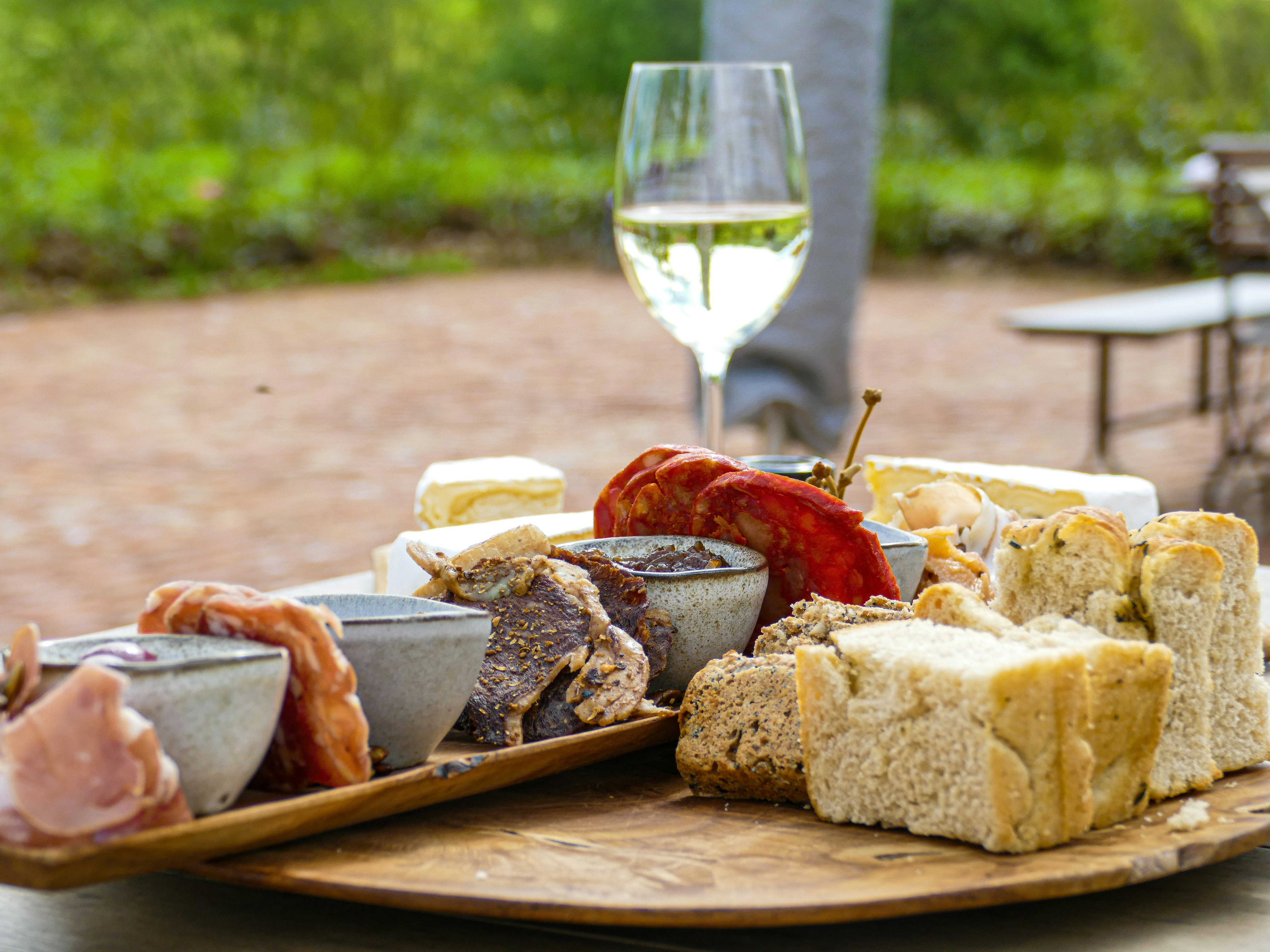 Antipasto plate with a glass of white wine