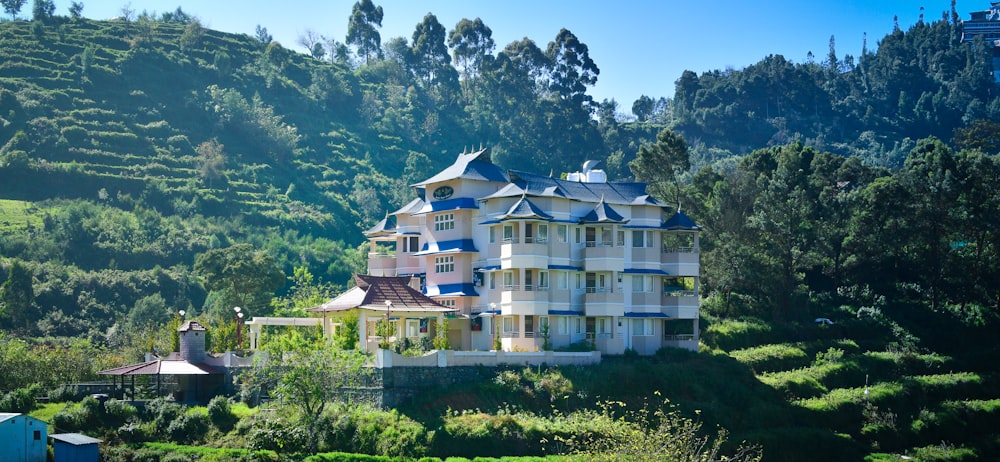 a large white house surrounded by trees