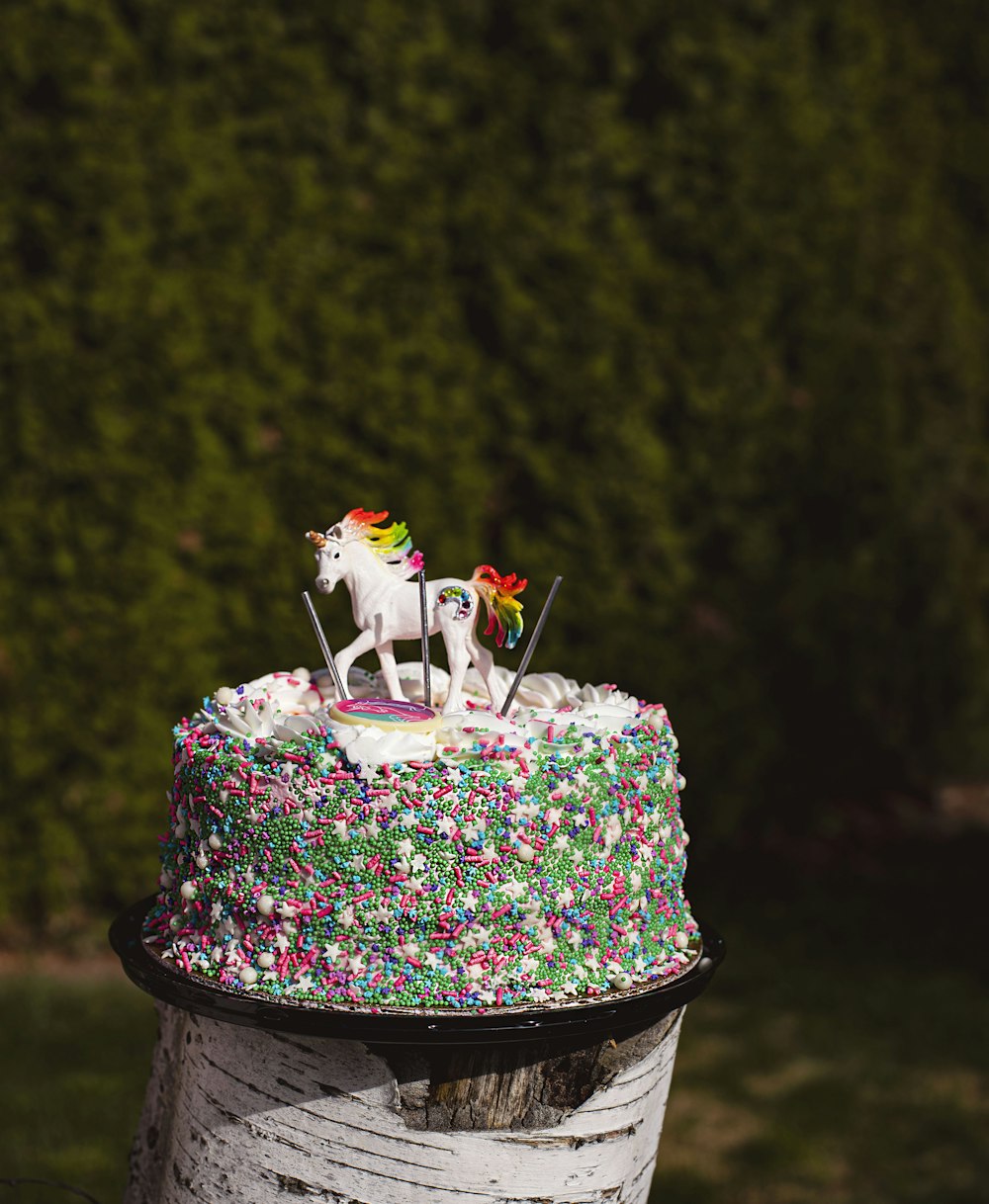 a group of horses on a cake