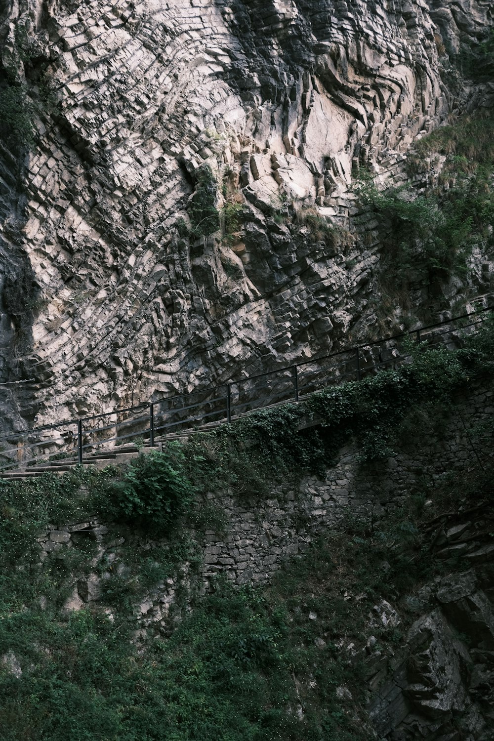 a bridge over a rocky cliff