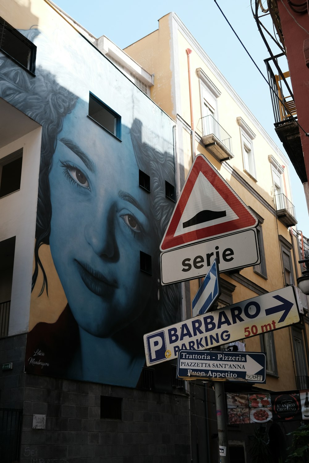 a street sign on the side of a building