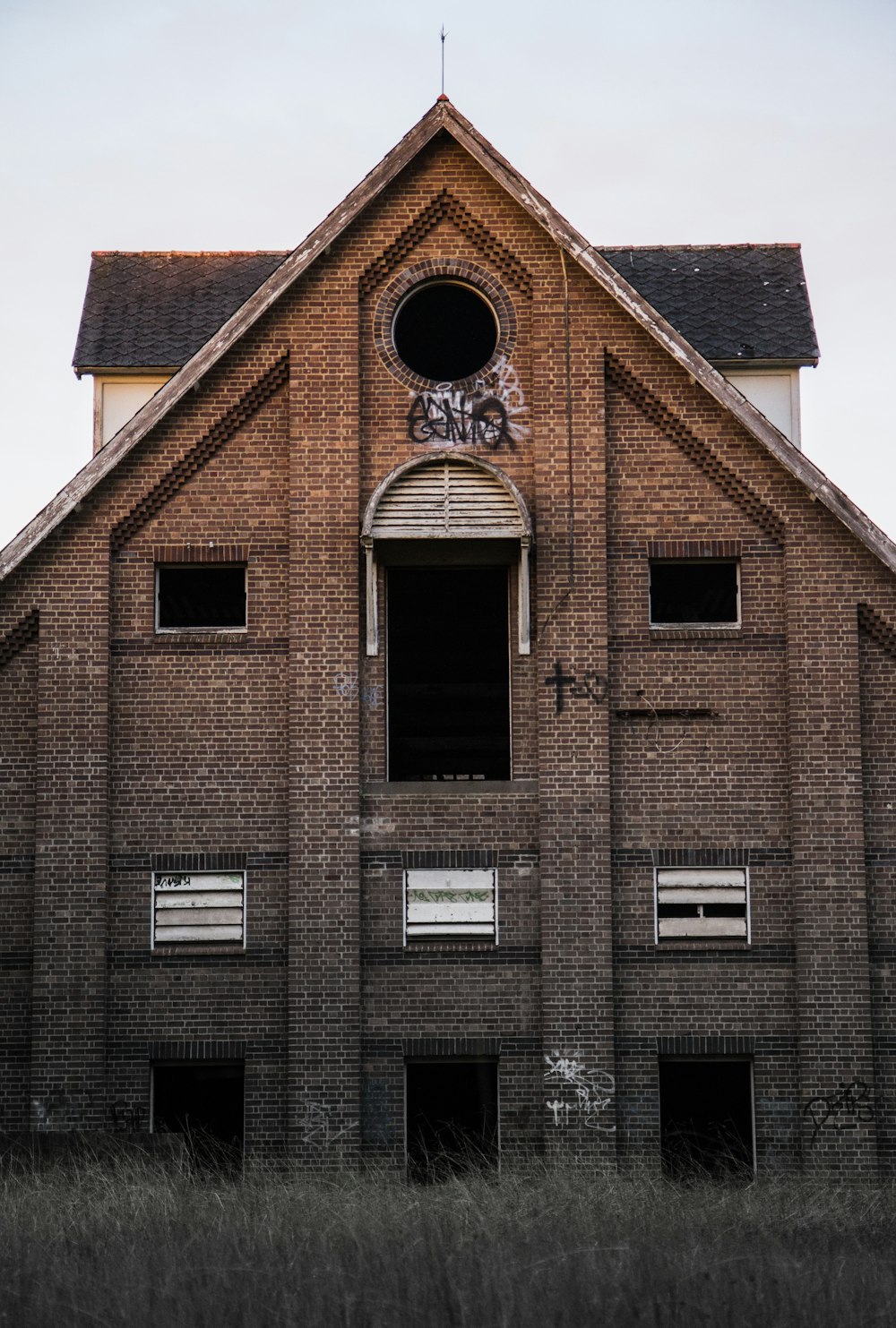 a brick building with a large arched window