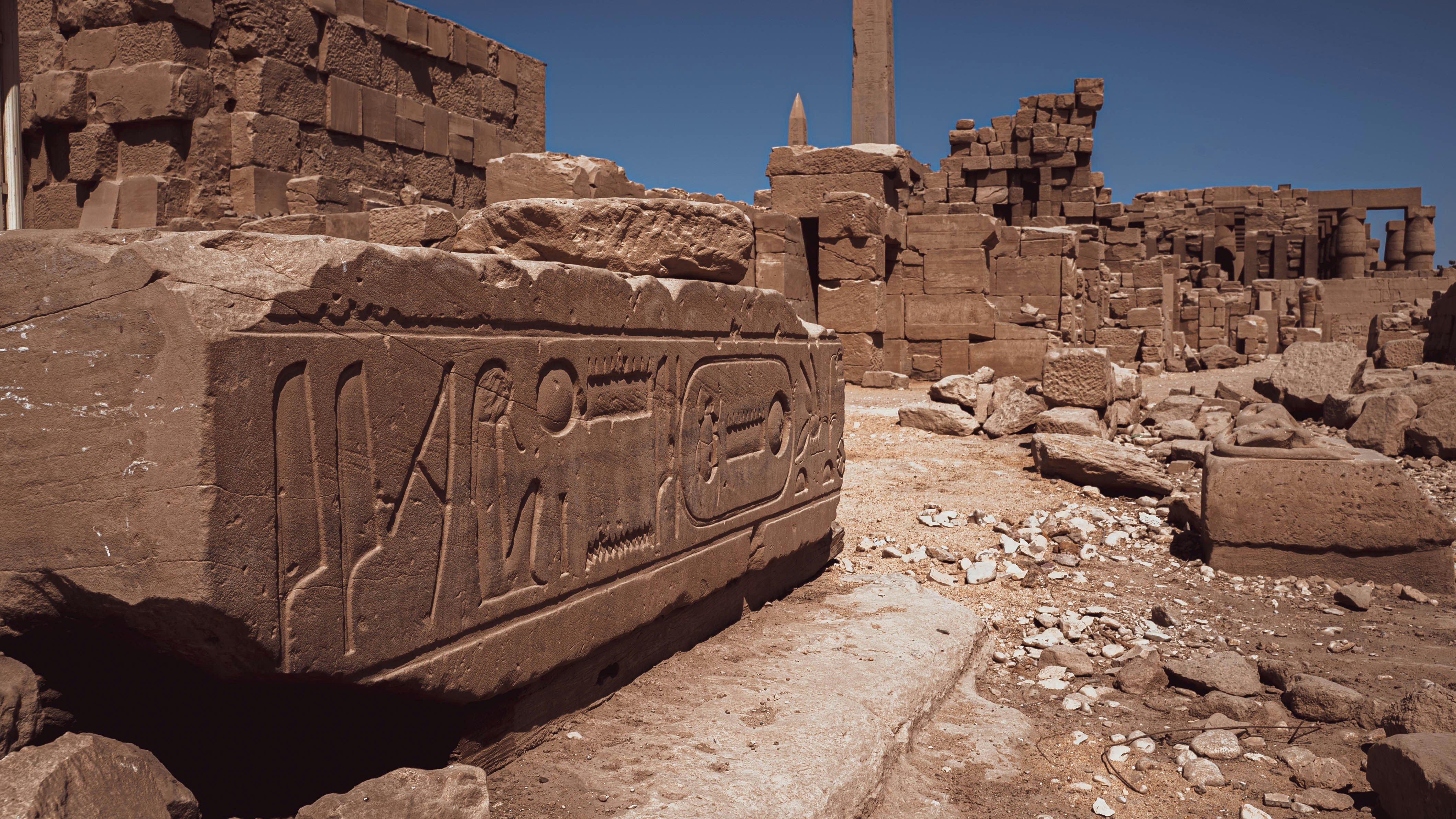 a stone structure with a sign on it, The beautiful Karnak Temple Complex in Luxor, Egypt.