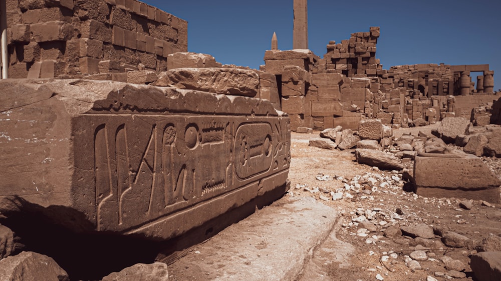 a stone structure with a sign on it