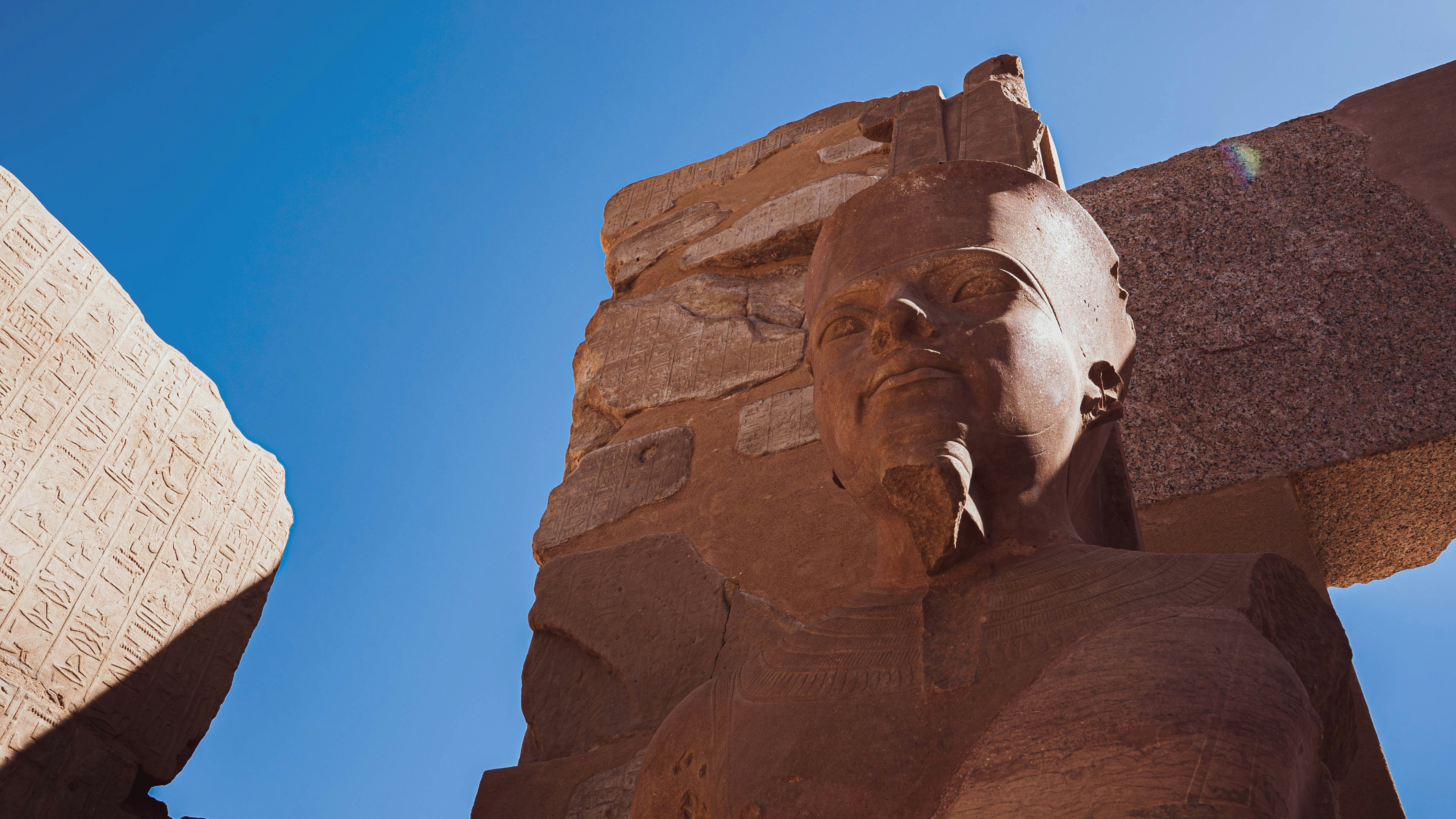 a statue of a person with a book and a book