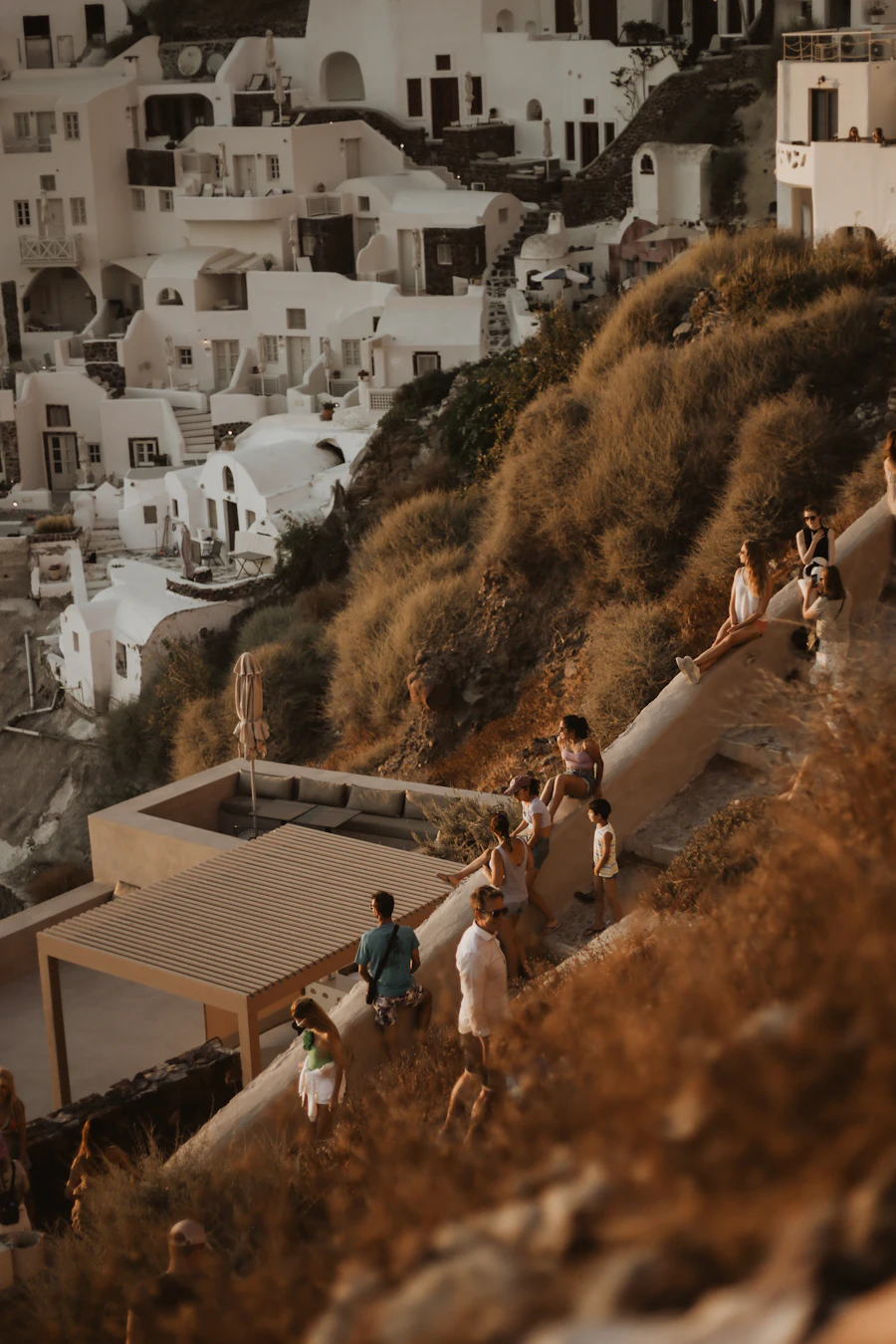Santorini Picnic local team on a caldera viewpoint at golden hour