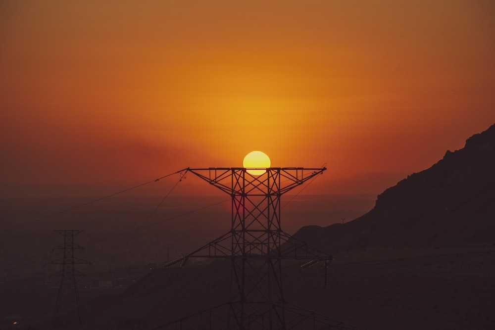 a sunset over a mountain range