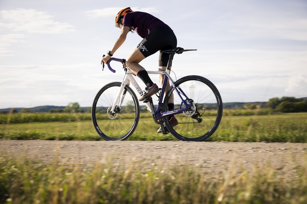 a man riding a bike on a road