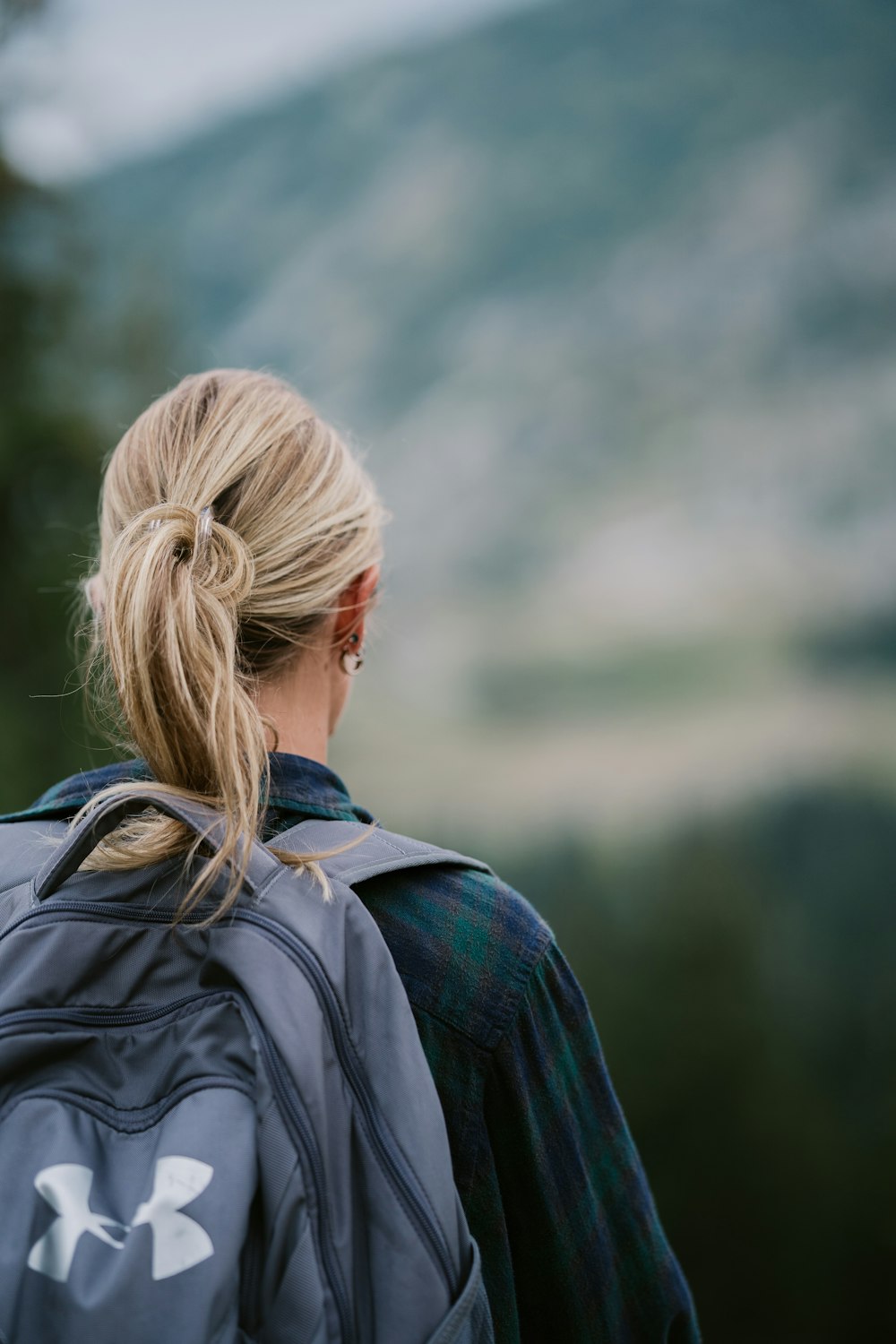 back view of a woman's back with a backpack