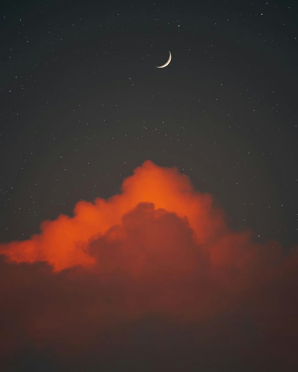 a cloud of smoke and a moon