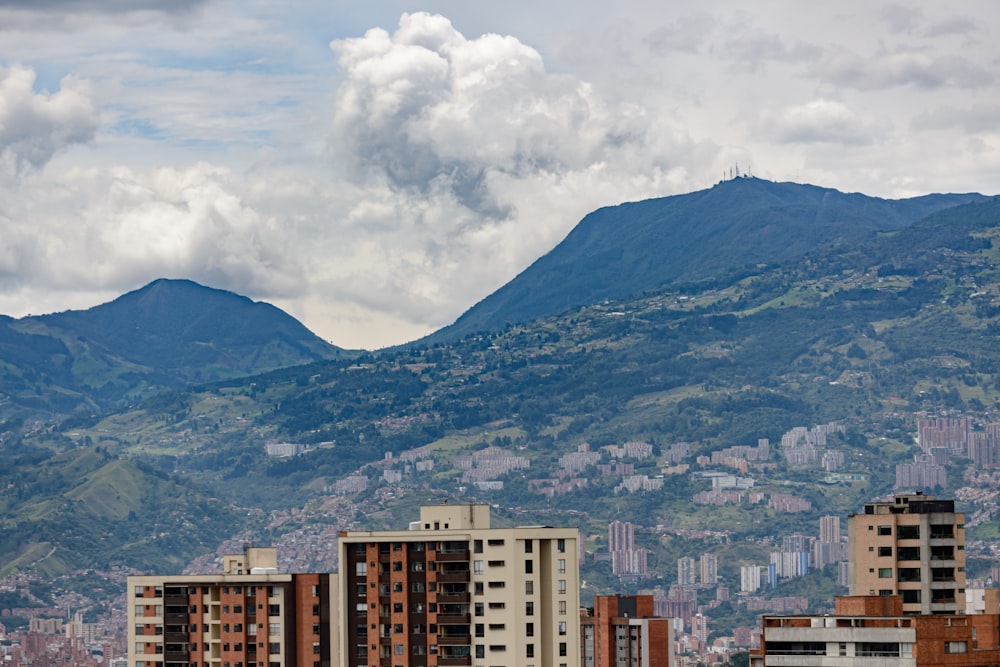 a city with mountains in the background