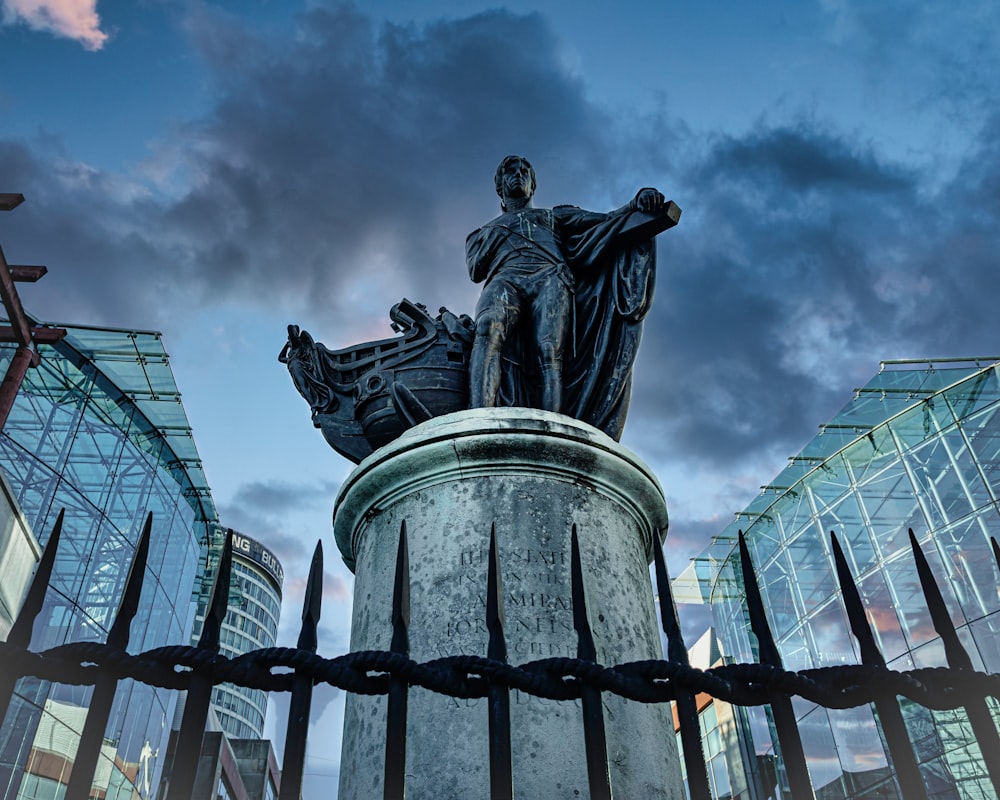 a statue of a person holding a gun