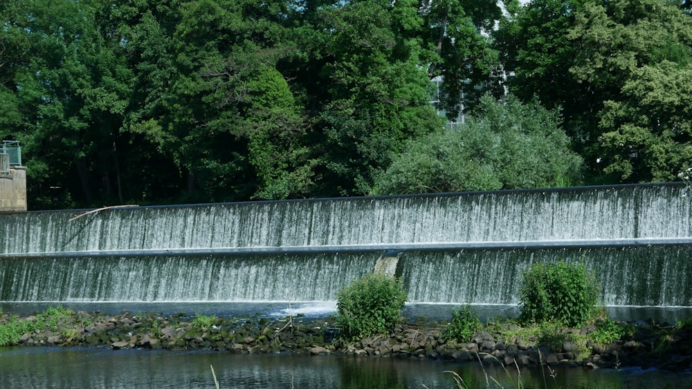 a concrete wall with trees in the background