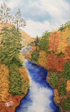 A serene landscape painting depicts a flowing river cutting through a forest with vibrant autumn foliage. The trees are painted in shades of gold, orange, and green, creating a rich tapestry of colors. The sky is bright and slightly cloudy, adding to the tranquil atmosphere of the scene.