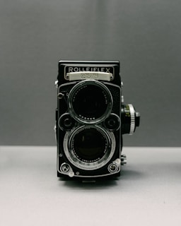 a black camera with a lens