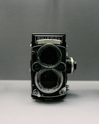 a black camera with a lens