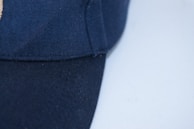 A close-up of a premium cap with golden accents.